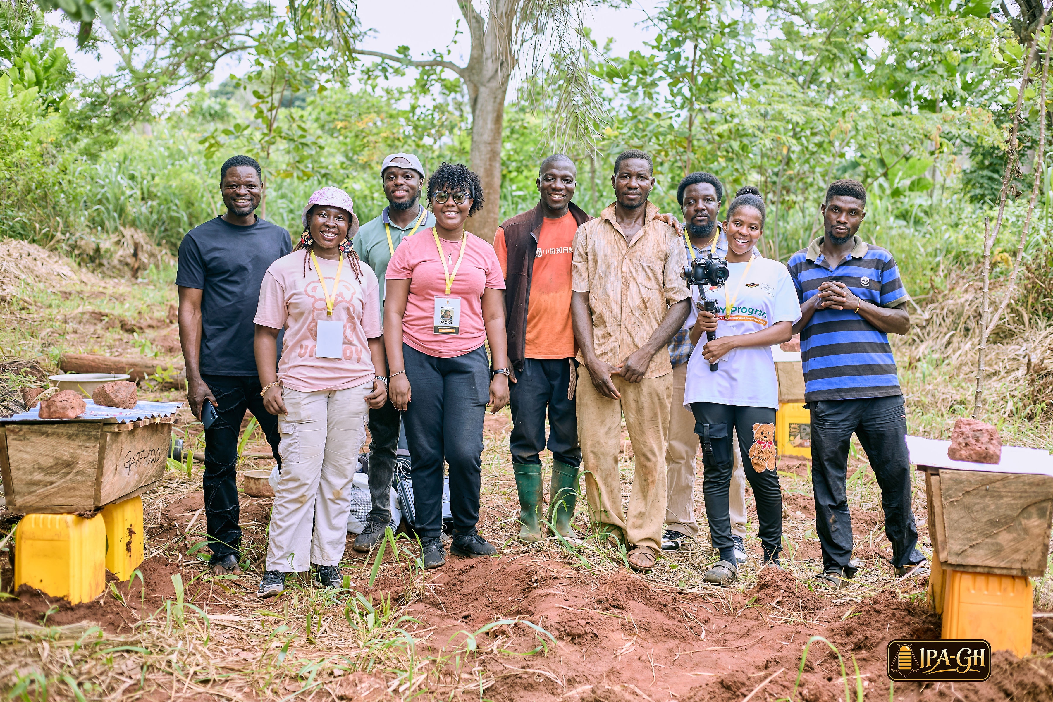 IPA Ghana team and local farmers with beehives in the Eastern Region